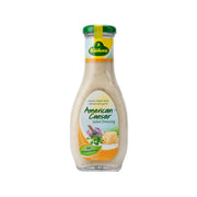 KUHNE American Caesar salad dressing bottle with green cap and creamy beige label