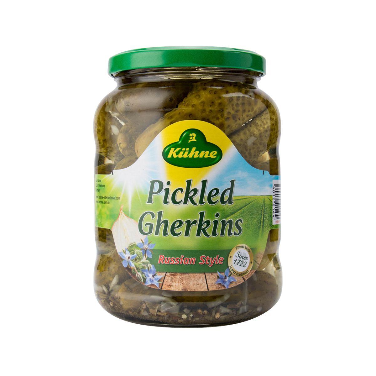 Jar of pickled gherkins with green lid, Russian style label on front