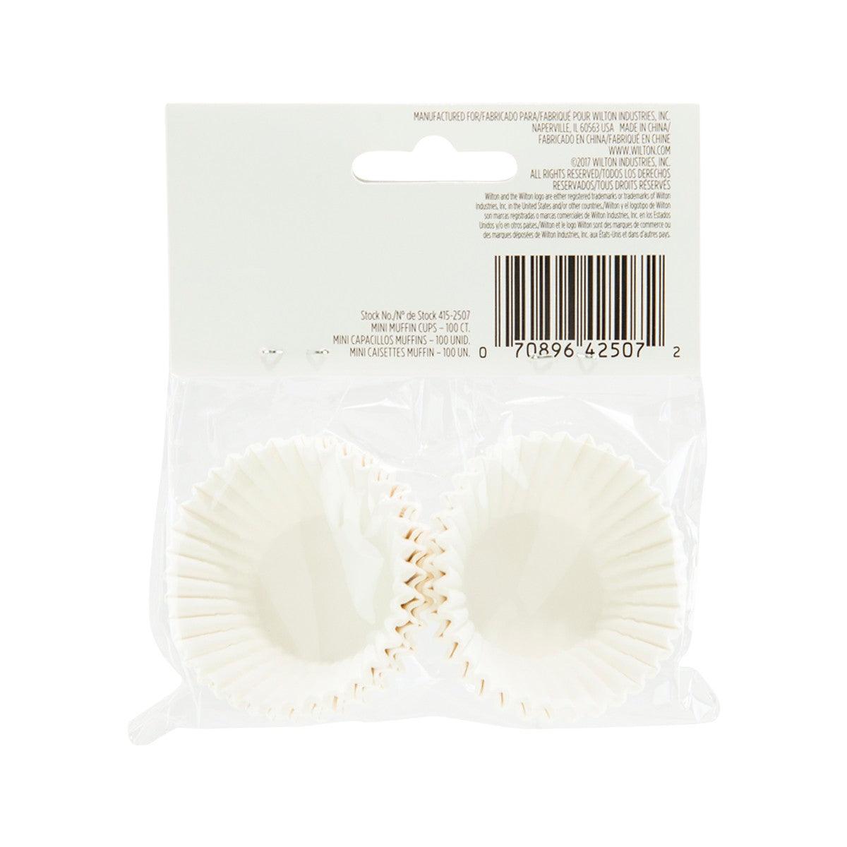 White mini paper baking cup liners, ridged sides, two shown through clear front