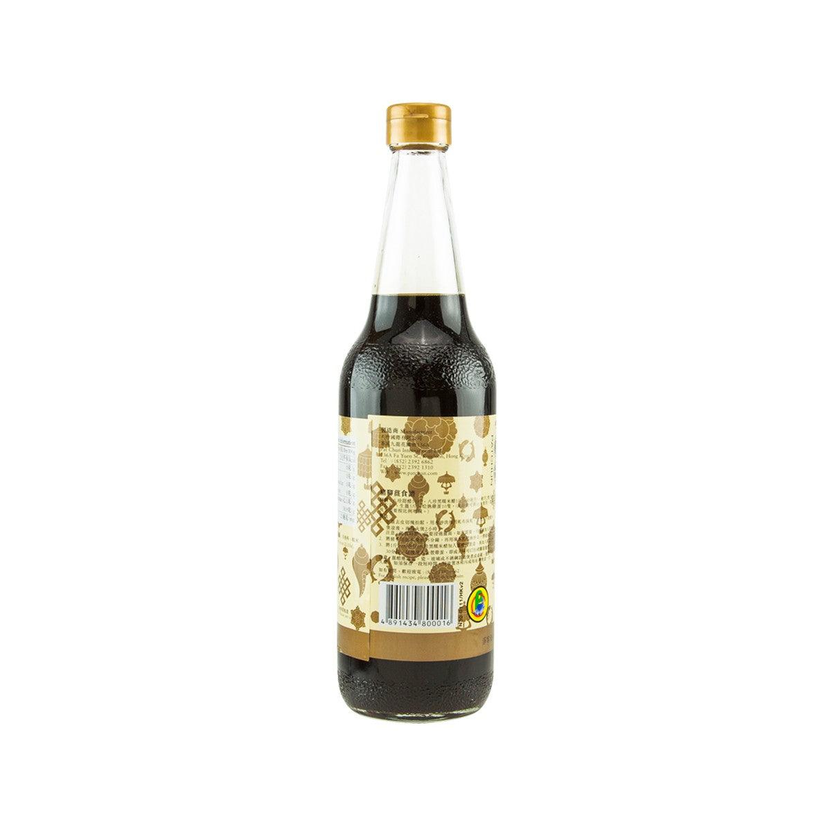 Bottle of sweetened vinegar sauce with gold cap and barcode back label