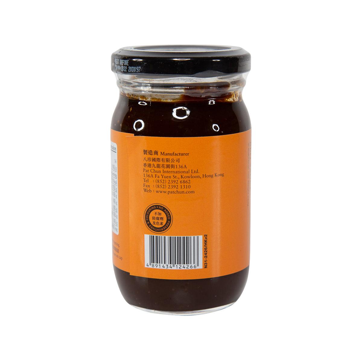 BBQ sauce jar with orange back label and black cap, dark brown sauce inside