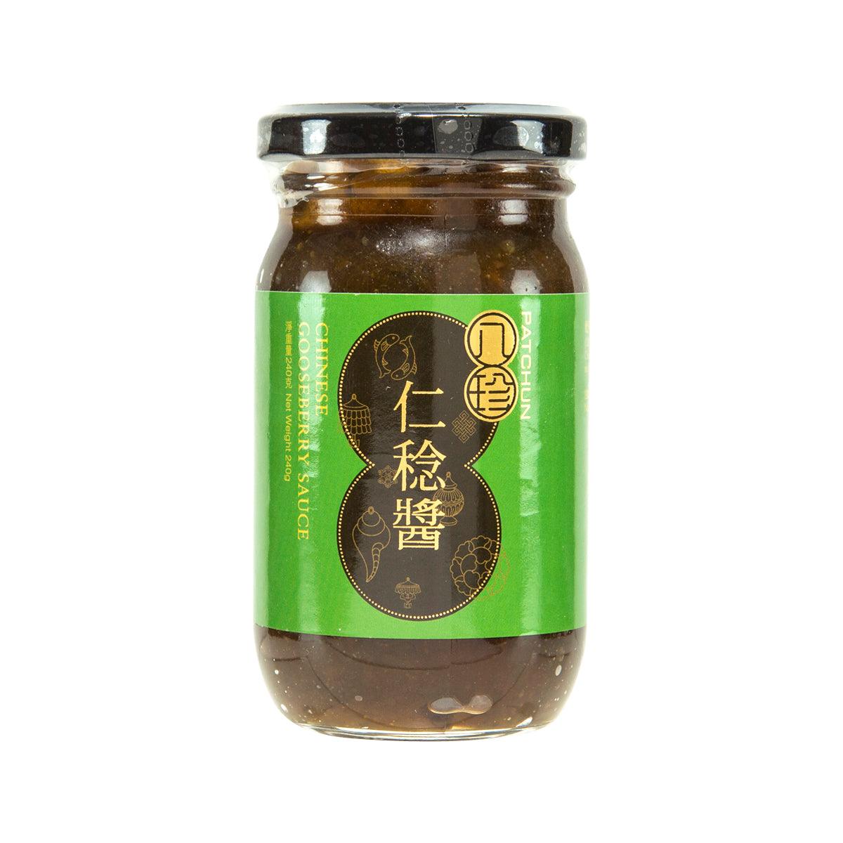 Chinese gooseberry sauce jar with green label and dark contents, black cap