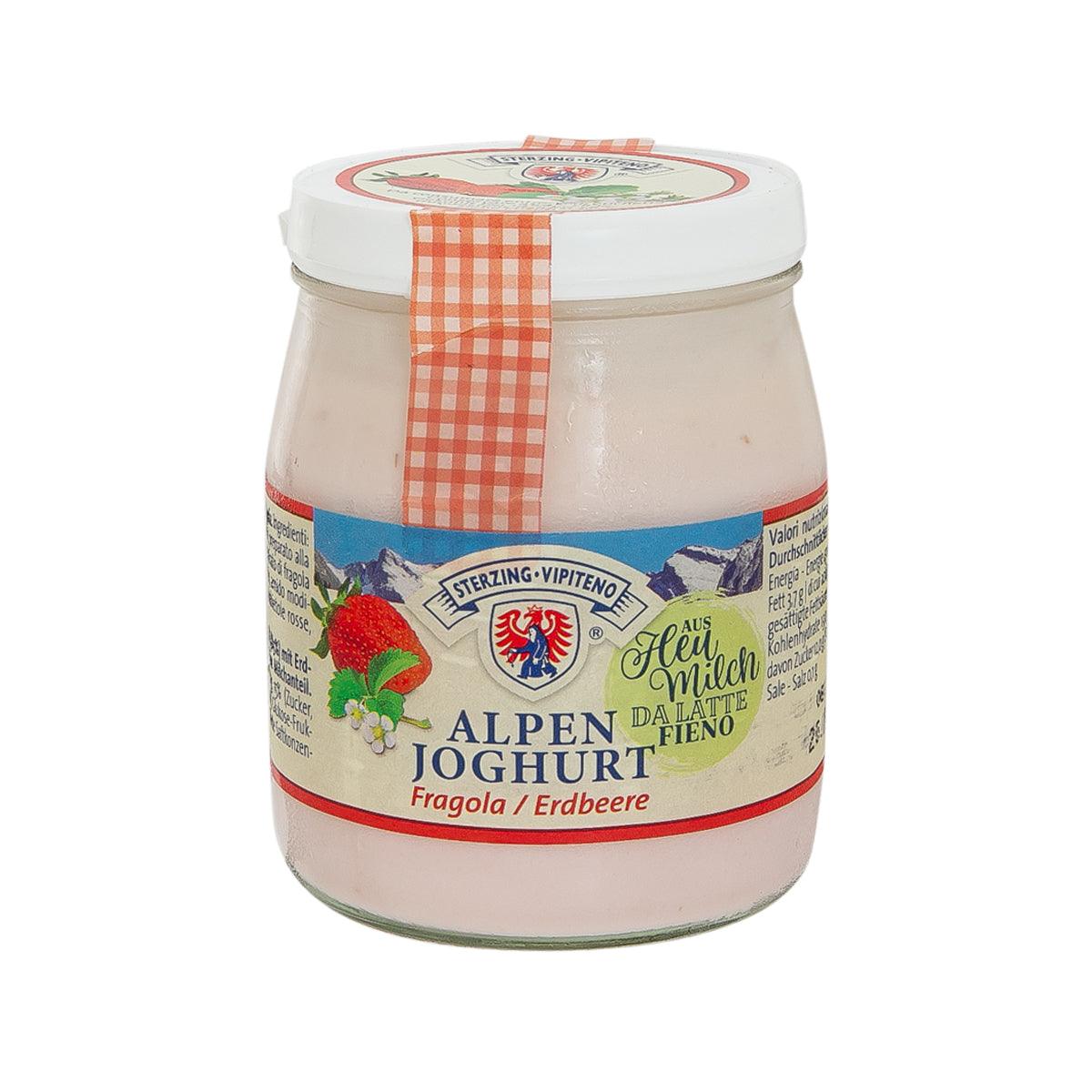 Strawberry Alpen yogurt in glass jar with white lid and red check ribbon label