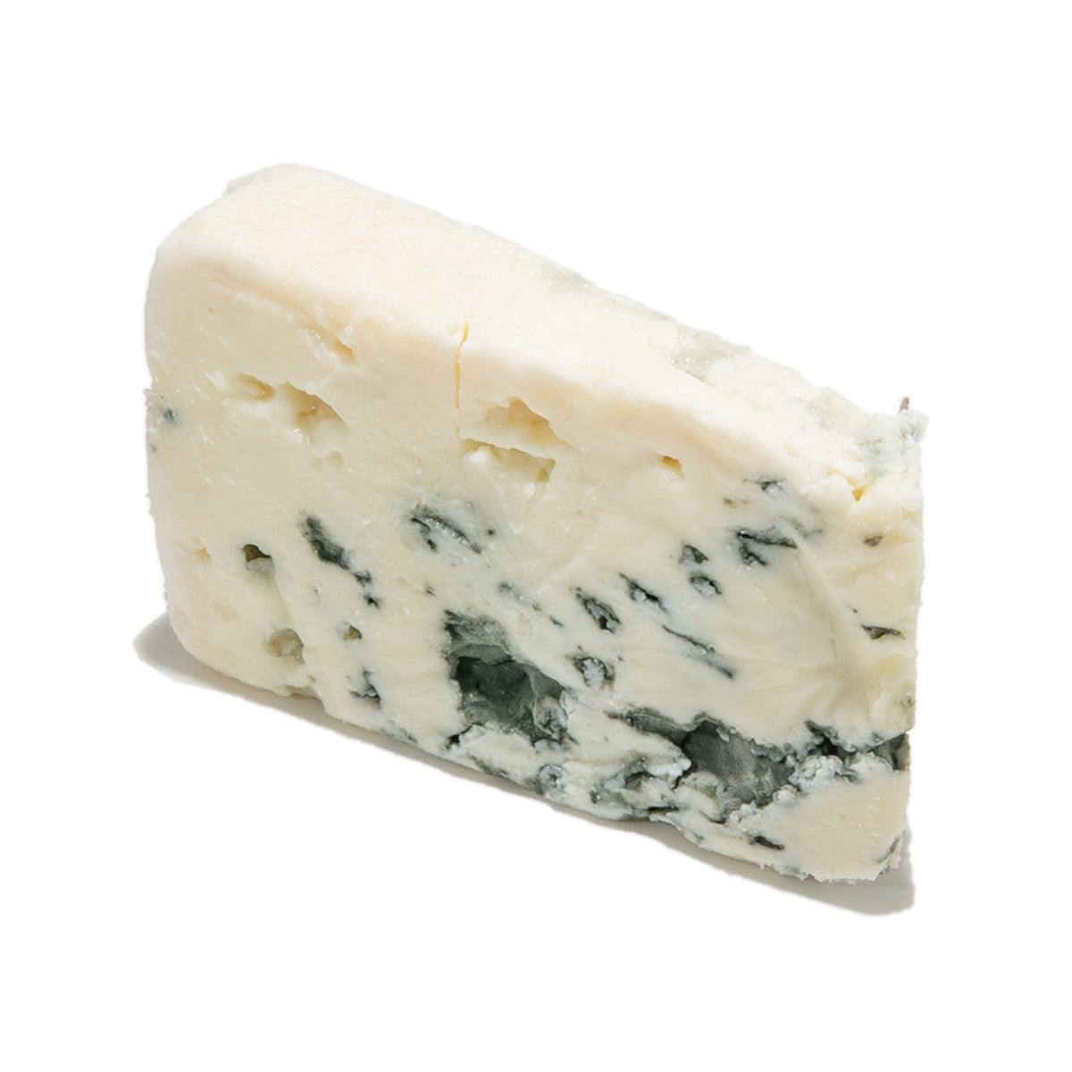 Roquefort blue cheese wedge with creamy white interior and blue veining