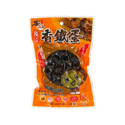 Spicy preserved quail eggs in pouch, orange package with black egg pieces illustration