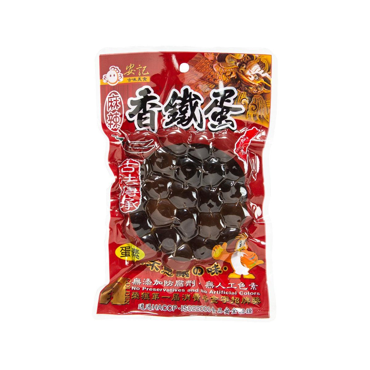 Hot & spicy preserved quail eggs pouch, red bag with dark egg pieces visible
