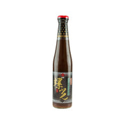 Condensed soy paste bottle with red cap, brown glass, and dark label