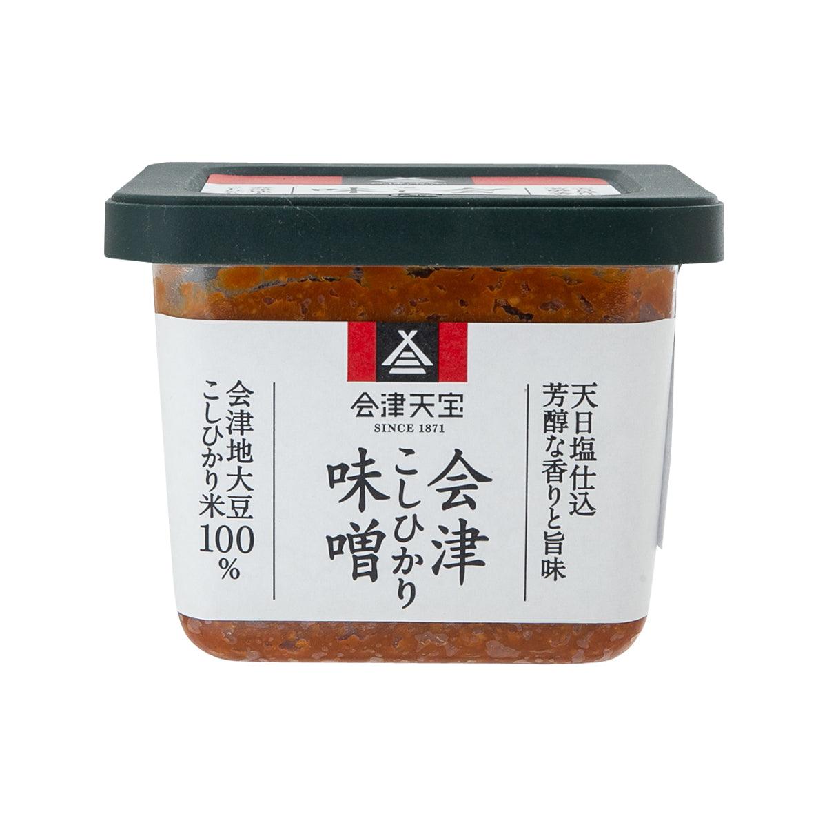 Rice miso paste jar with dark lid and white label, brown-orange contents