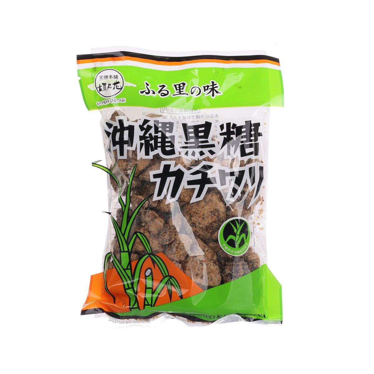Okinawa brown sugar bag with green front label and dark brown sugar granules visible