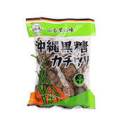 Okinawa brown sugar bag with green front label and dark brown sugar granules visible