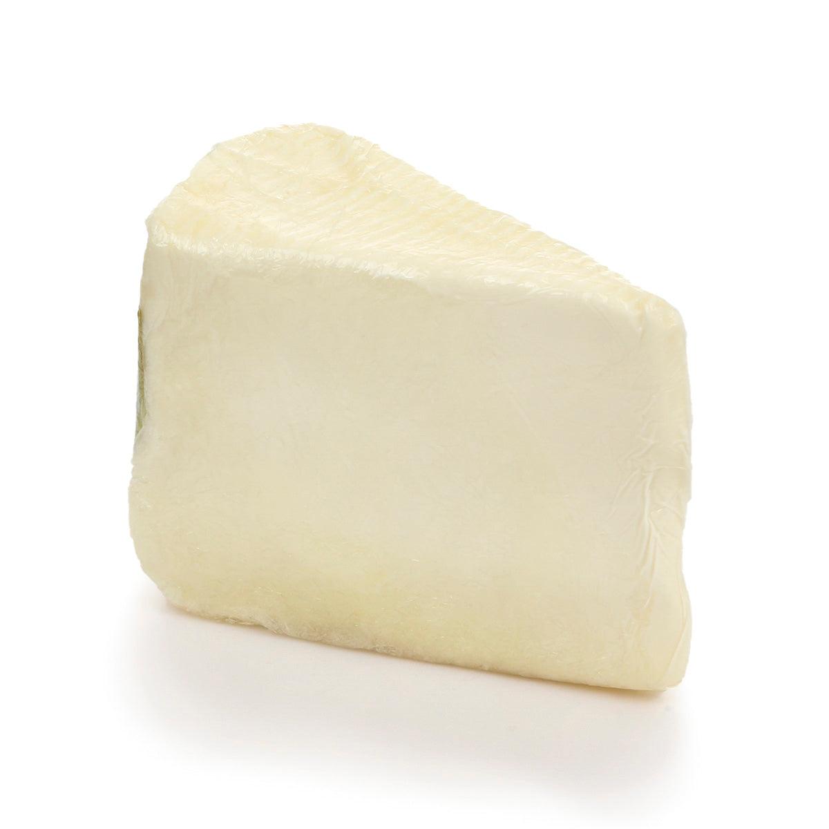 Pale cream triple cream cheese wedge, unwrapped
