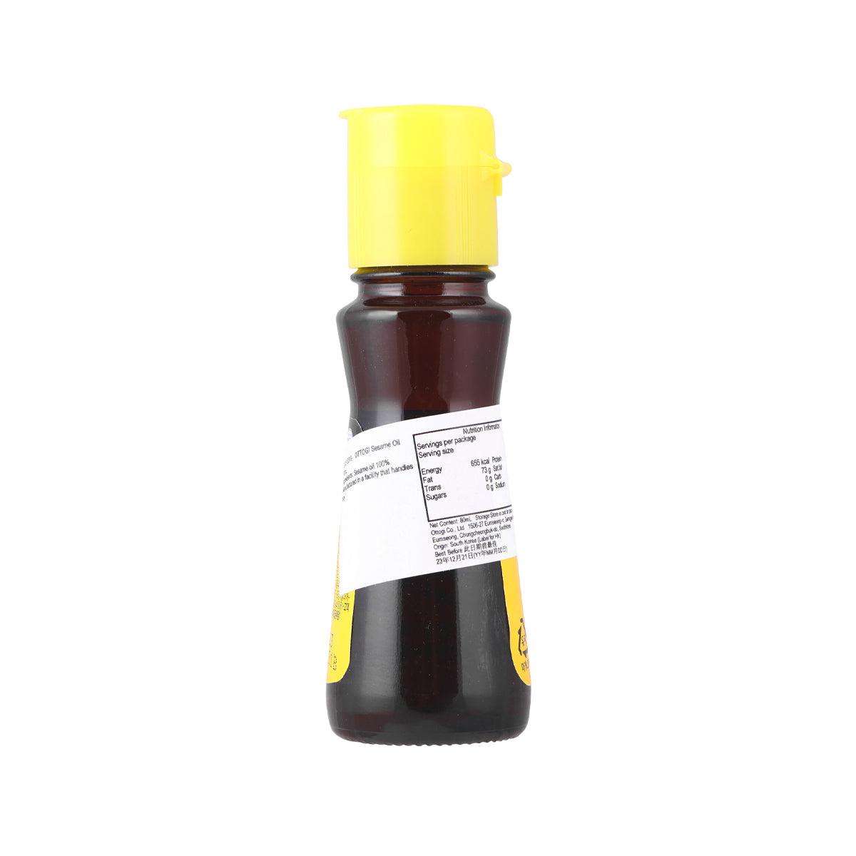 OTTOGI sesame oil bottle, back label view, yellow cap on dark amber 80 mL bottle