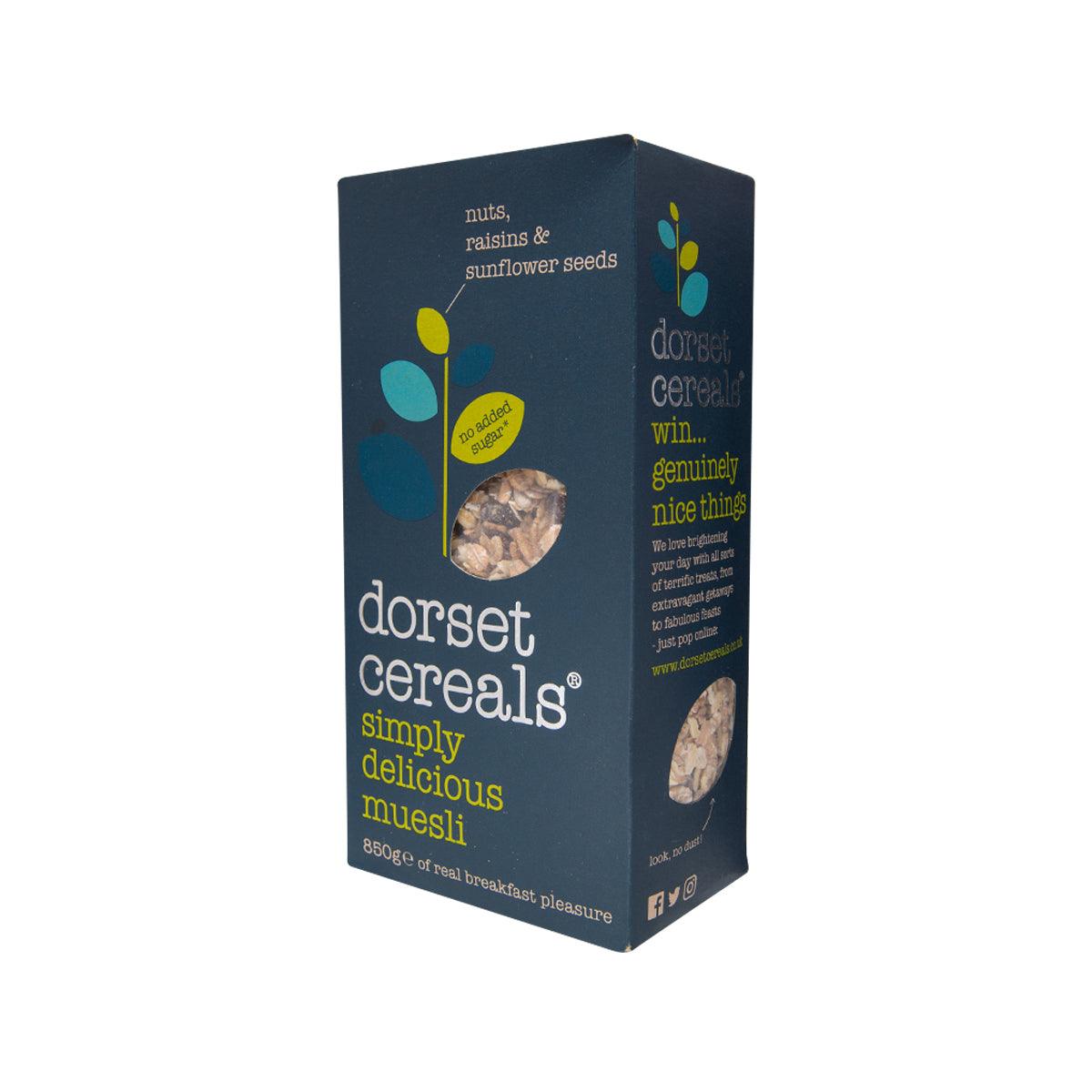 Dark blue muesli cereal box angled, showing side text and product window