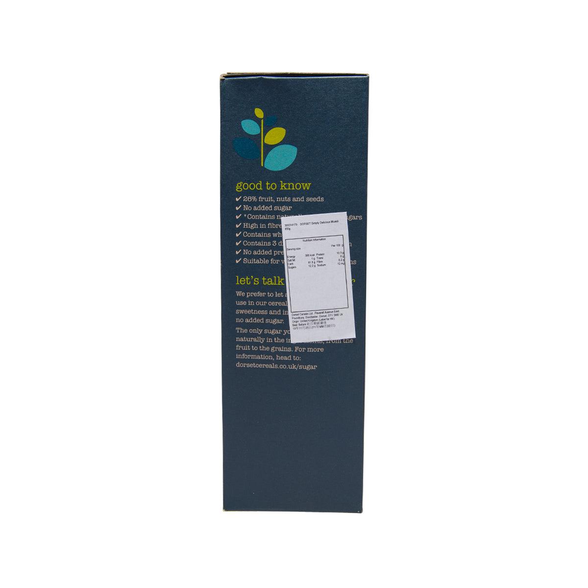 Dark blue muesli cereal box back with nutrition table and “let’s talk” text
