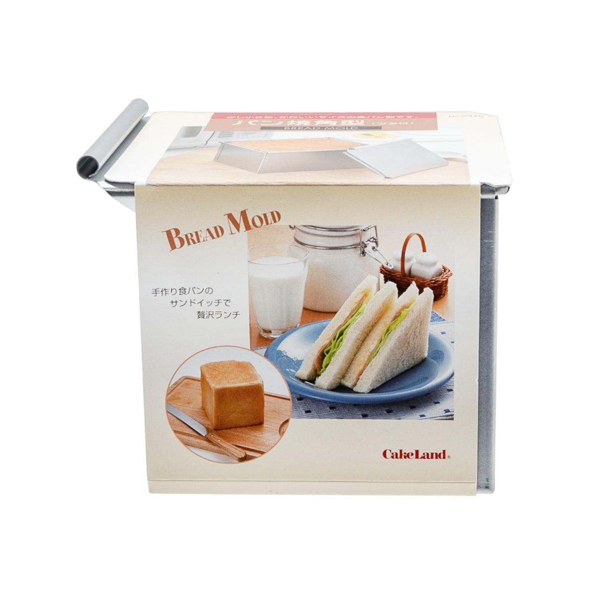 Metal bread mold with lid, rectangular shape, shown in retail box packaging