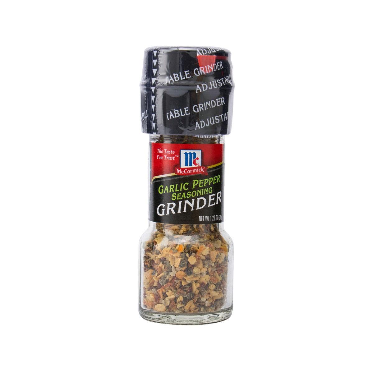 McCormick garlic pepper seasoning grinder, clear glass filled with spice mix