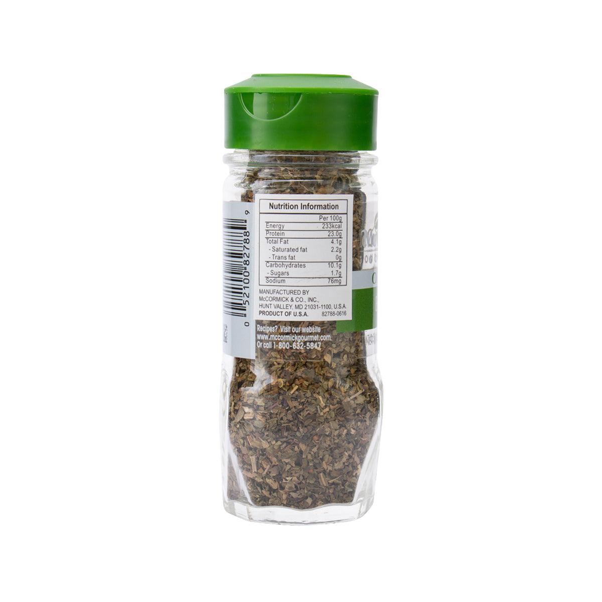 Organic basil seasoning bottle back label on clear glass jar with dried herbs
