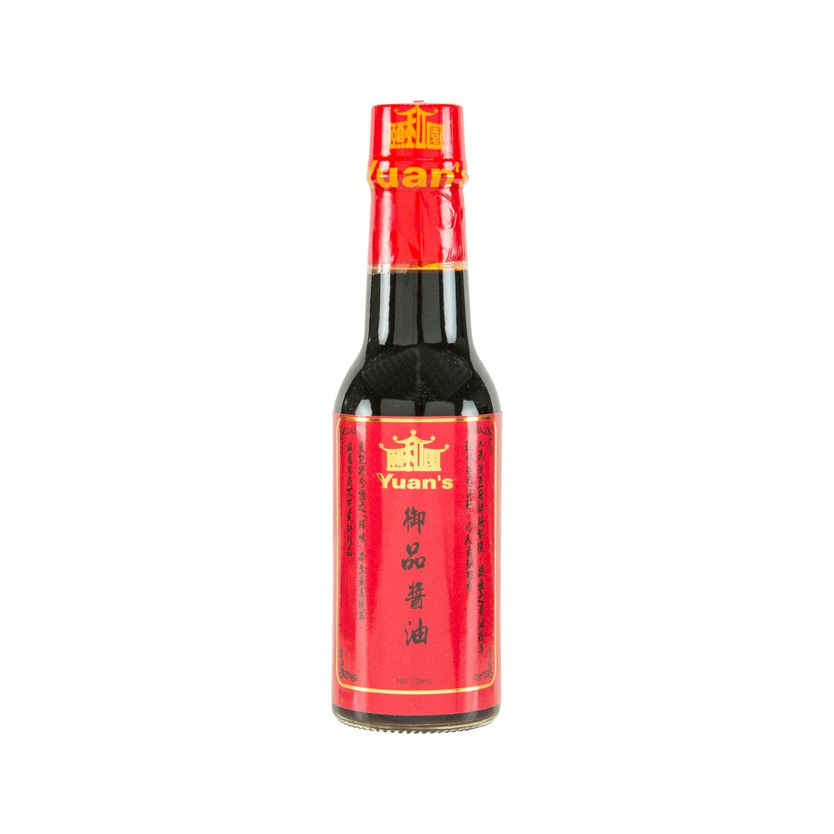 YUAN'S Royal soy sauce bottle with red label and black glass, front view.