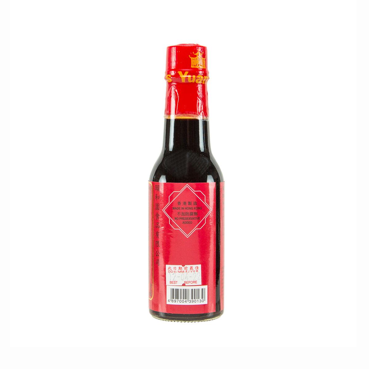 YUAN'S Royal soy sauce bottle with red back label and black glass.