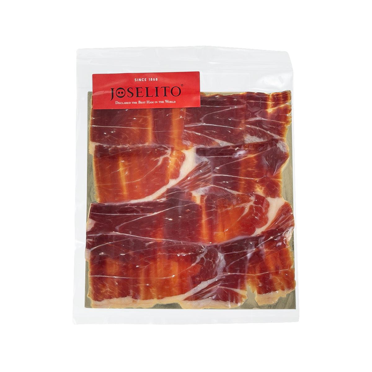 Hand-sliced iberico bellota ham, vacuum-sealed pack with marbled red slices