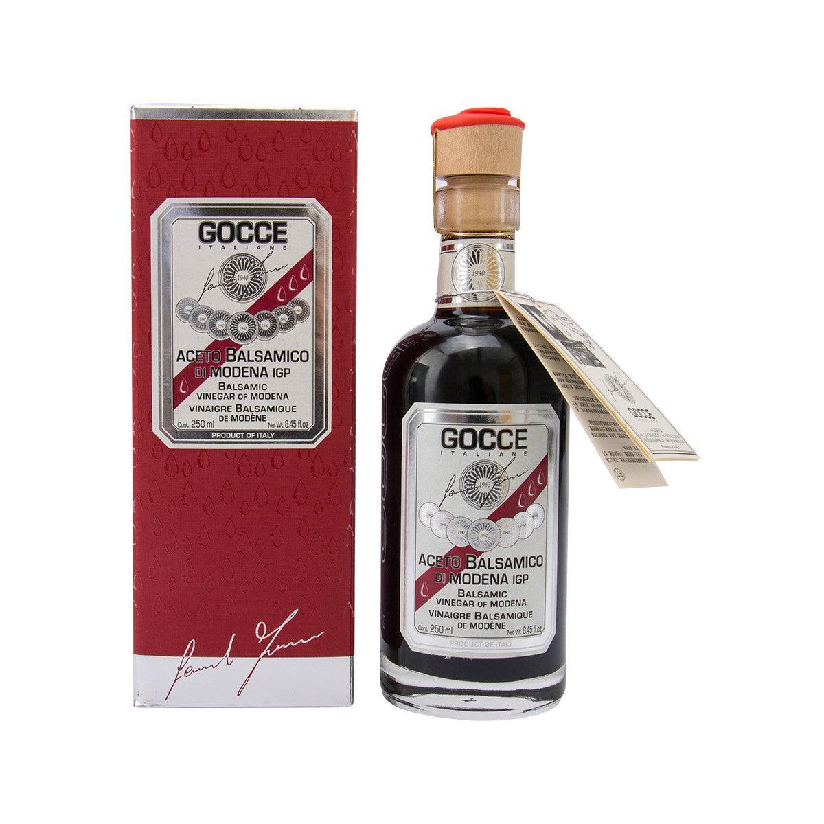 GOCCE balsamic vinegar bottle in glass with red cap and red-and-white label