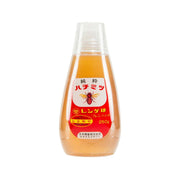 Renge Jurushi honey in clear plastic squeeze bottle, amber honey visible, front label