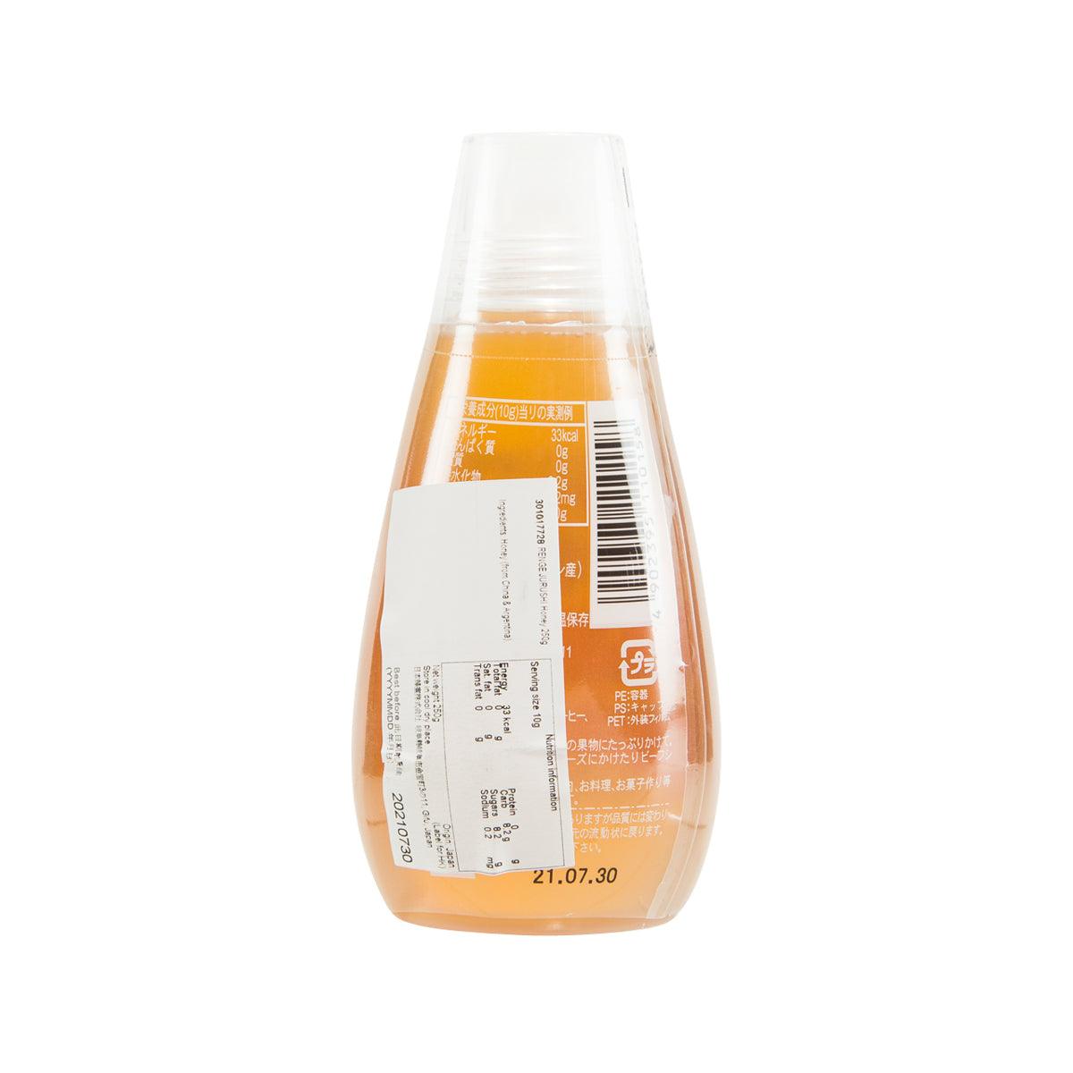Renge Jurushi honey bottle with barcode and back label, amber contents visible