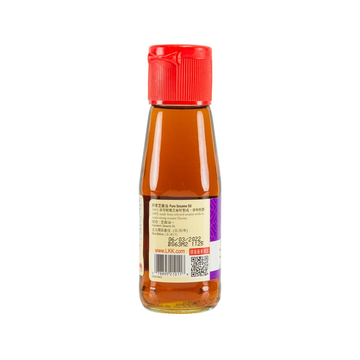 Amber sesame oil bottle with red cap, back label, barcode, and stickers