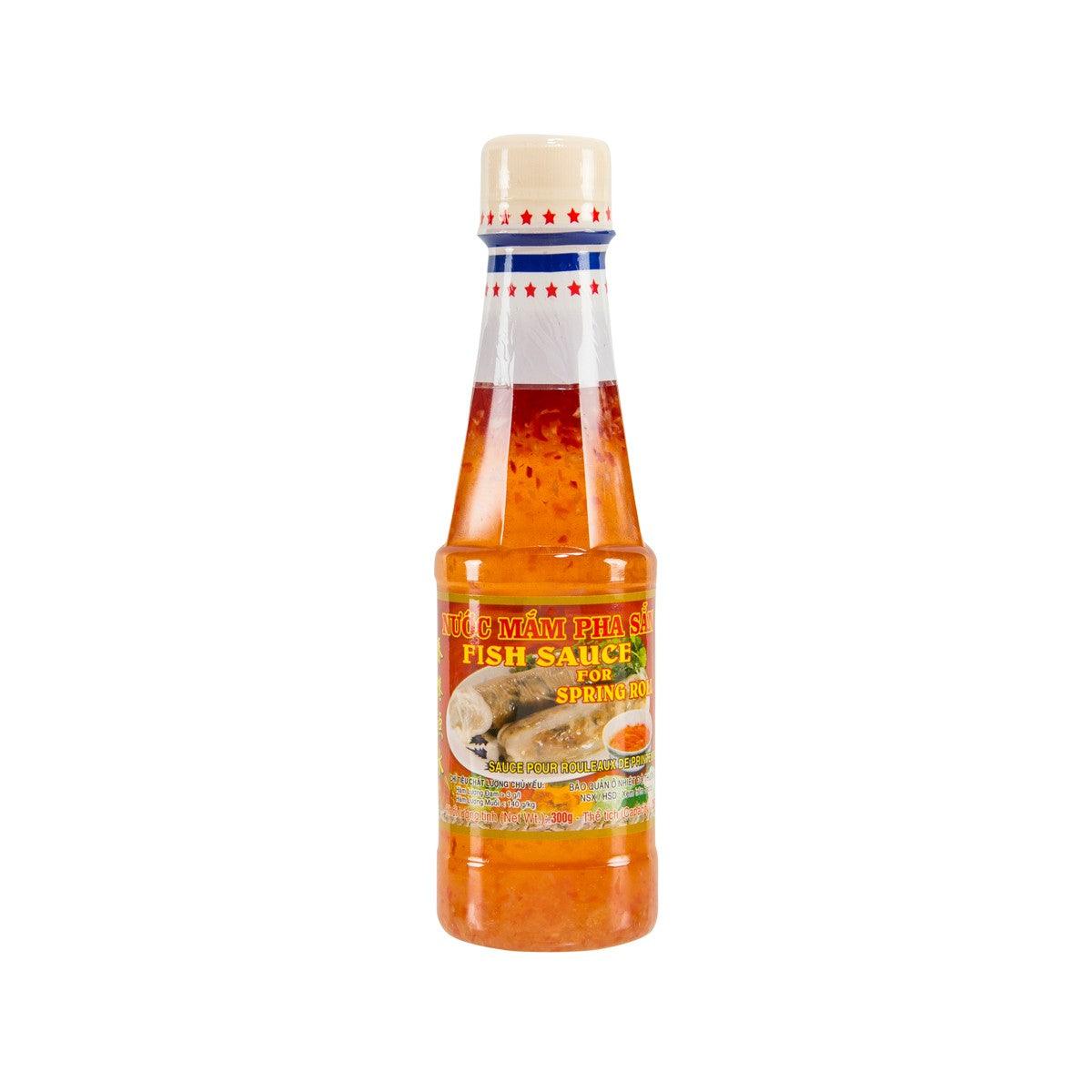 CHL fish sauce for spring rolls, clear bottle with amber liquid and red cap