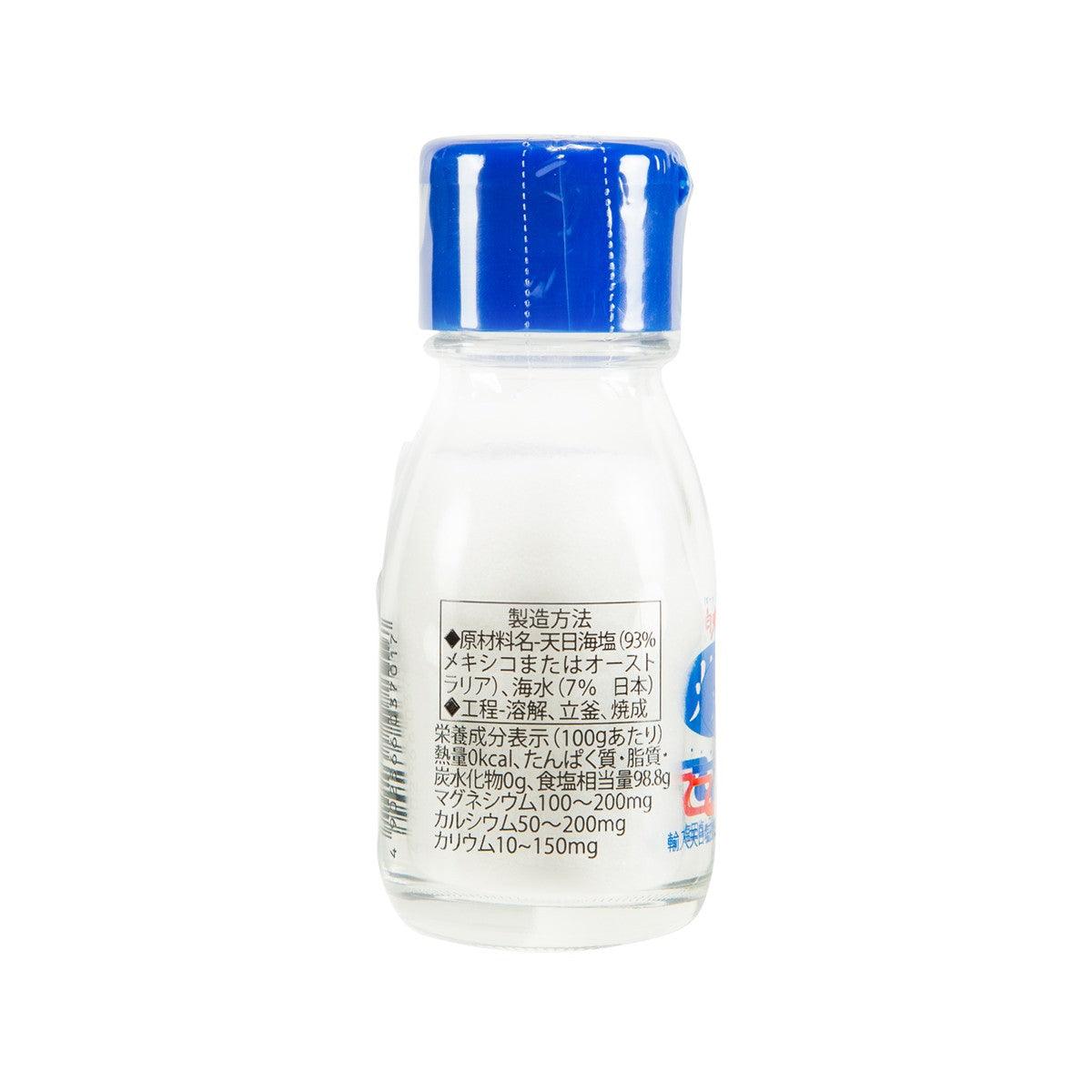 Roasted seasalt bottle with blue cap, clear glass, back label visible