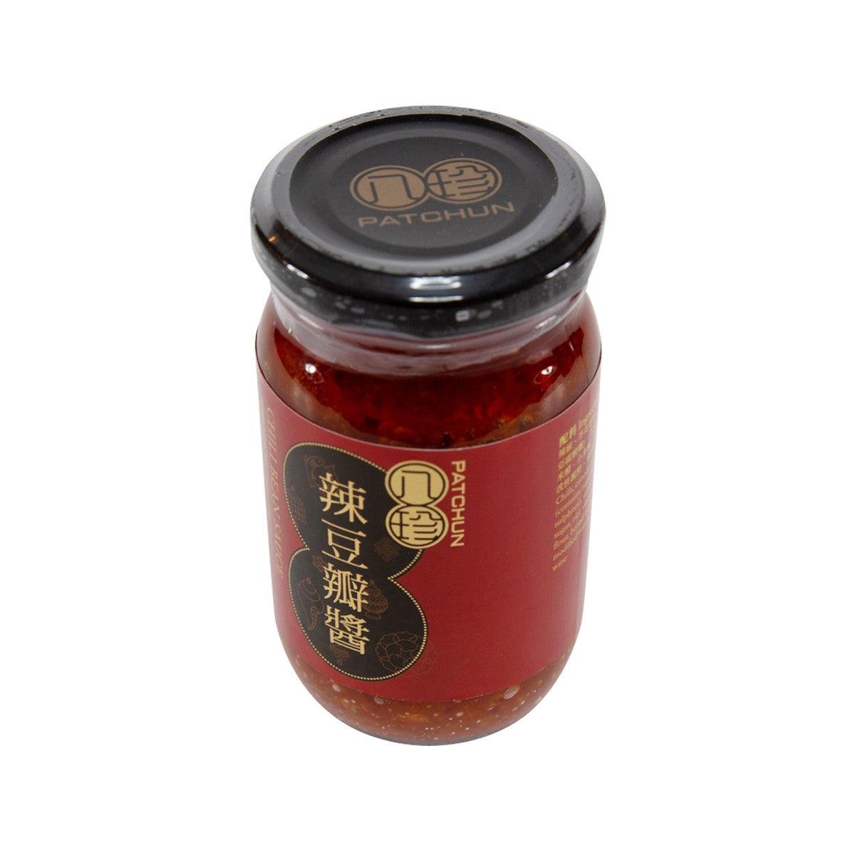 Red chili bean sauce jar with black screw lid and front label