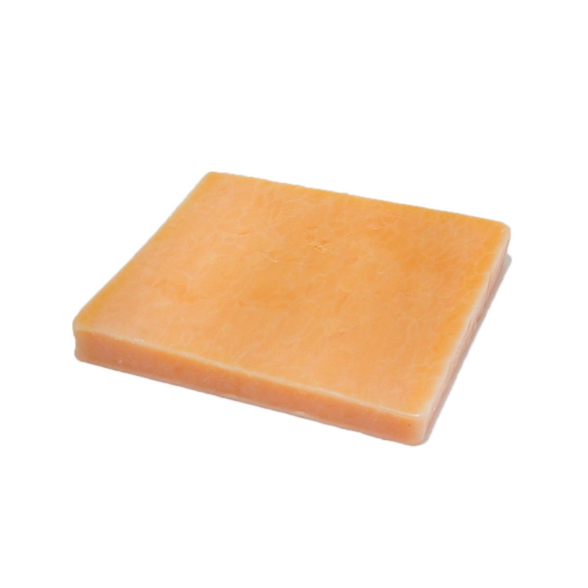 FREYBE old cheddar cheese wedge, orange block with smooth rind