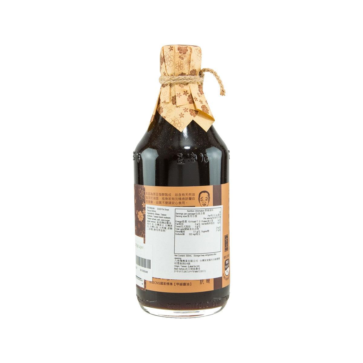 Soy sauce bottle back view, dark glass with fabric tie and barcode label