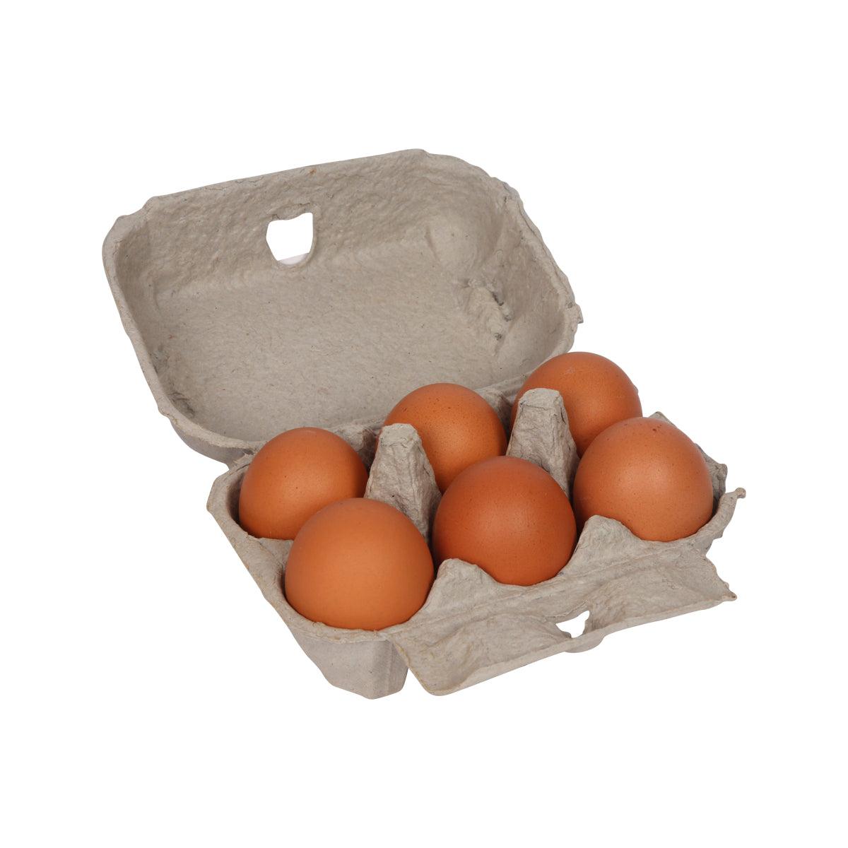Open egg carton holding six brown free range eggs