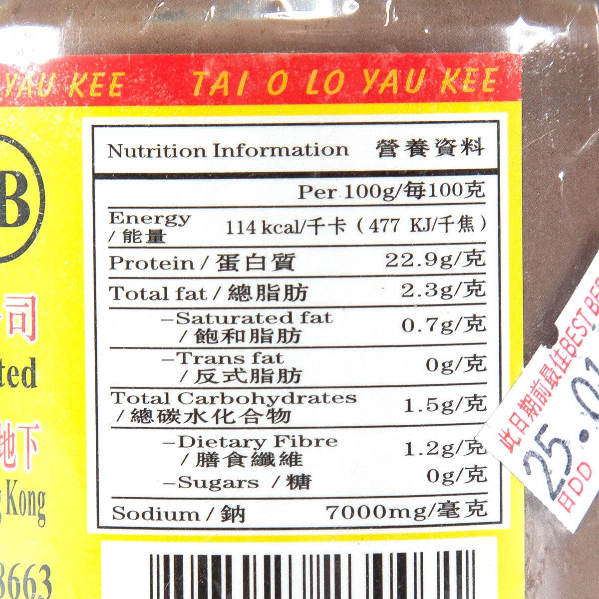 Close-up nutrition information label on fine shrimp paste jar, per 100g.