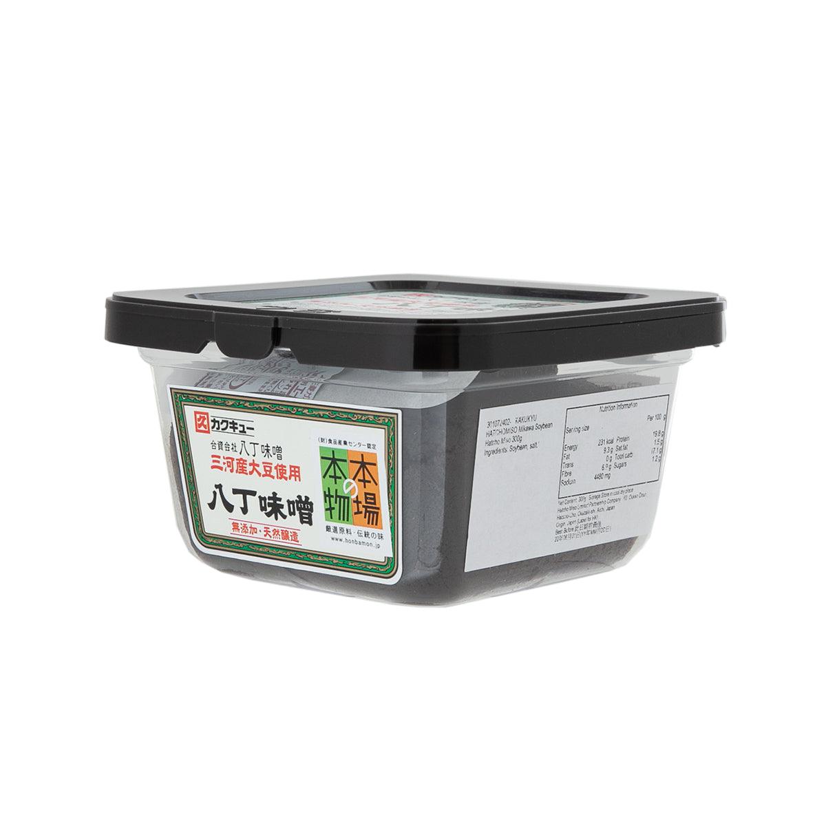 Hatcho miso paste tub side view with ingredient label and black lid
