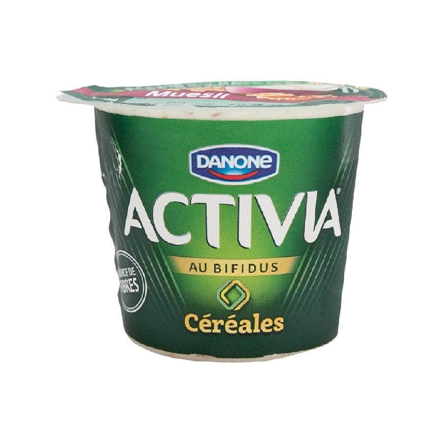 Green DANONE Activia yogurt cup with muesli (cereals) label