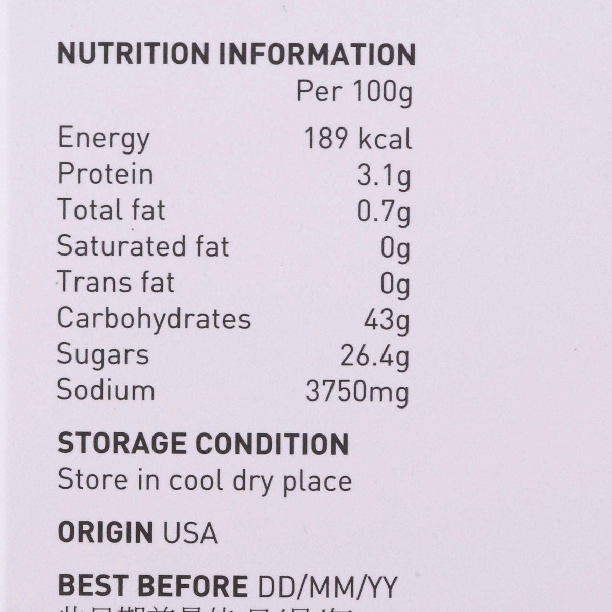 Nutrition information close-up, per 100g energy and macros on broth concentrate label.