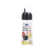 Transparent oil dispenser bottle with black pump top and pouring spout, 200 mL