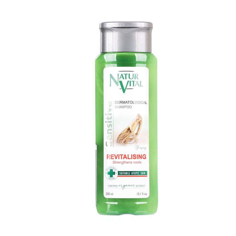 Green revitalising hair shampoo bottle with silver cap and front label