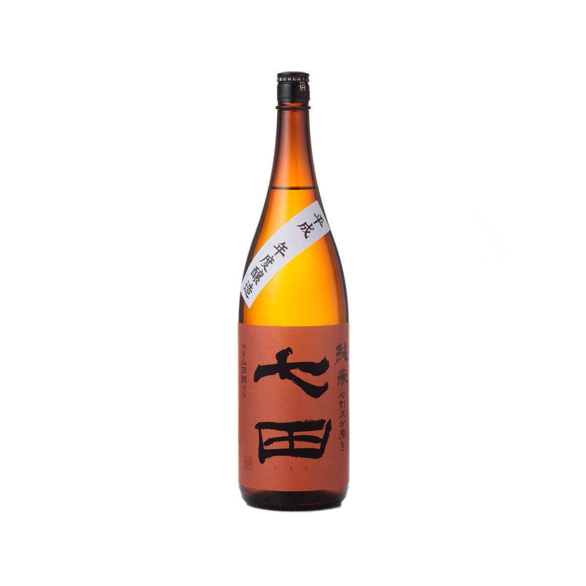 SHICHIDA 75 Junmai sake bottle, amber glass with dark cap and Japanese-character label