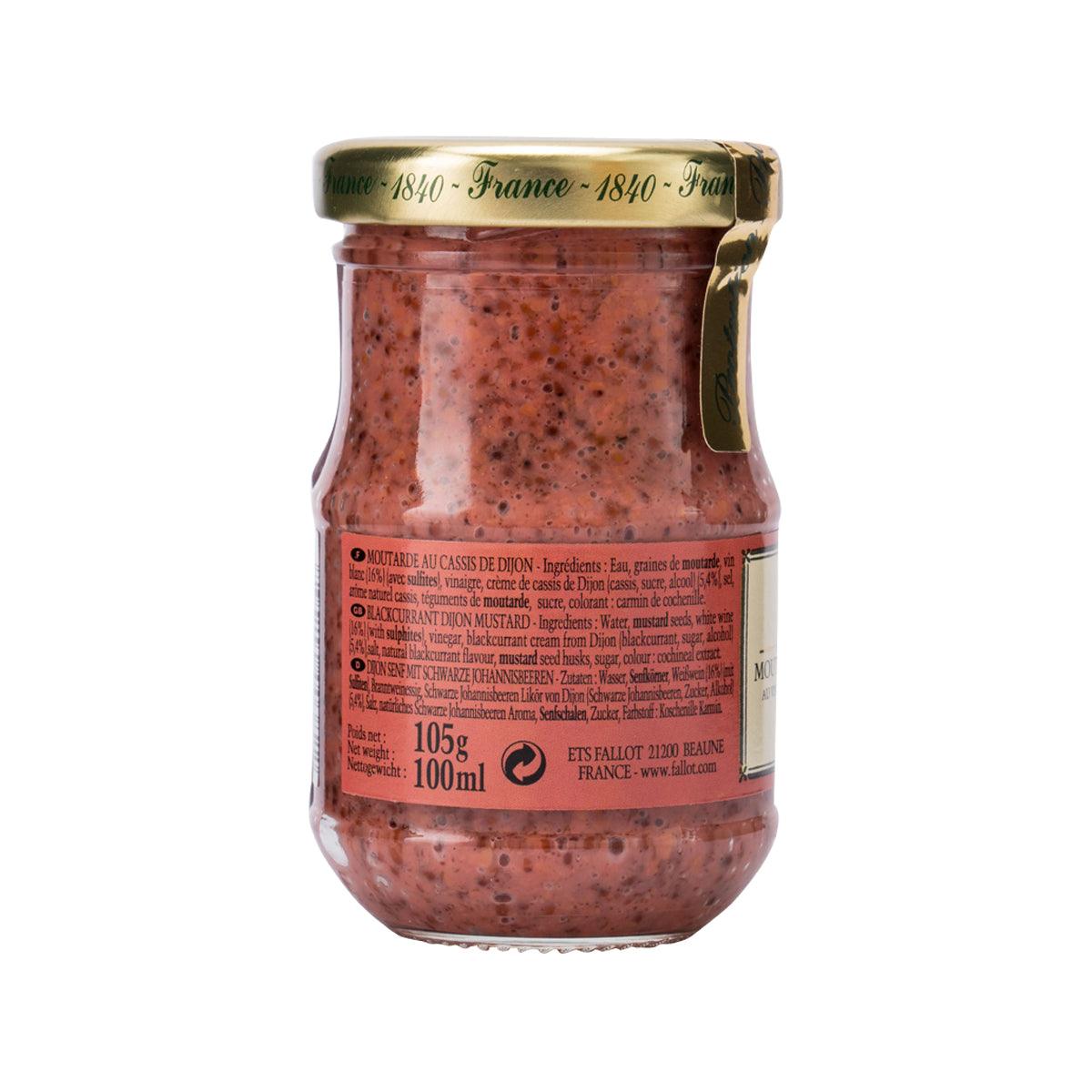 Glass jar of blackcurrant Dijon mustard with side ingredient label and gold lid
