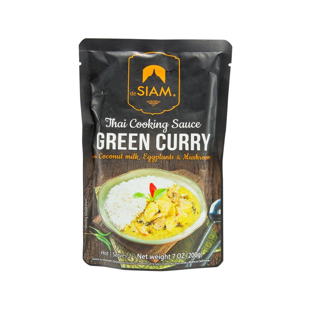 Green curry cooking sauce pouch, black with green curry dish photo