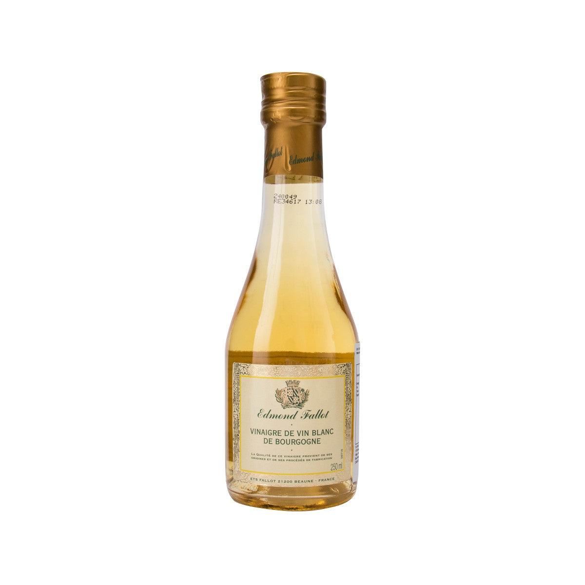 Wine vinegar bottle with amber liquid, glass body, and gold screw cap