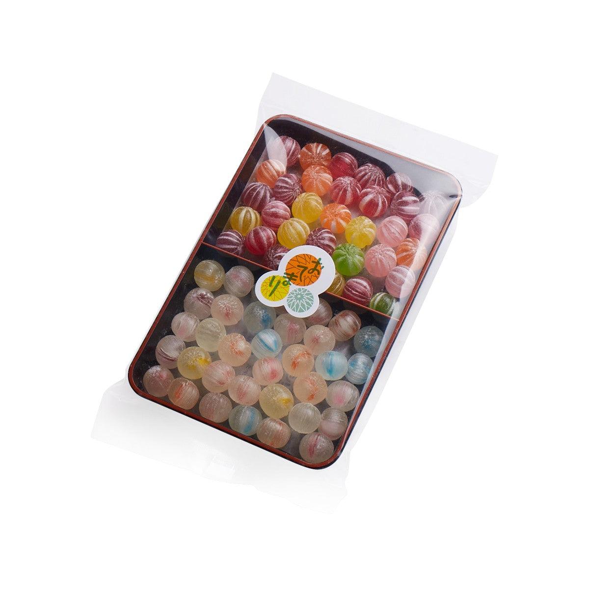 Otemari toy ball candies tray with mixed pastel and dark hard candy spheres