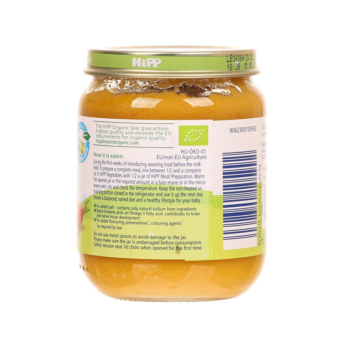 Organic mixed vegetable baby food jar with green lid, orange puree, back label visible