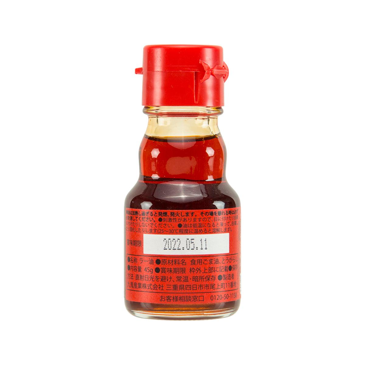 KUKI spicy sesame oil bottle with red cap and back label ingredients text