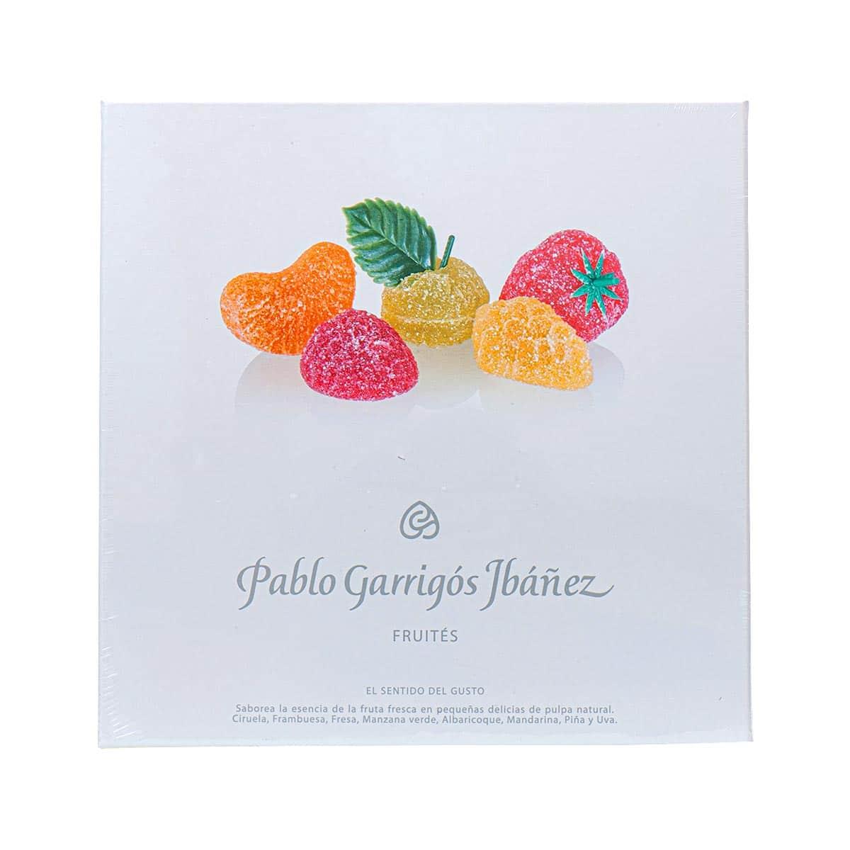Assorted fruit candies in a branded white box, colorful gummy pieces with mint leaves