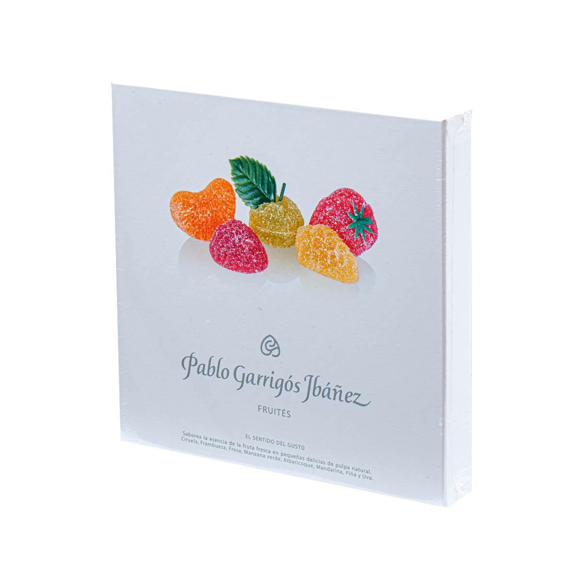 Assorted fruit candies in a branded white box, angled view of colorful gummy pieces