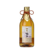 MANZAIRAKU aged umeshu bottle with foil neck wrap and tied red ribbon